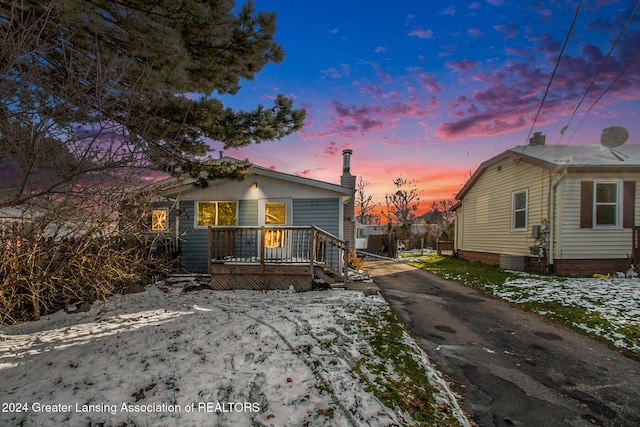 view of front of property with a wooden deck