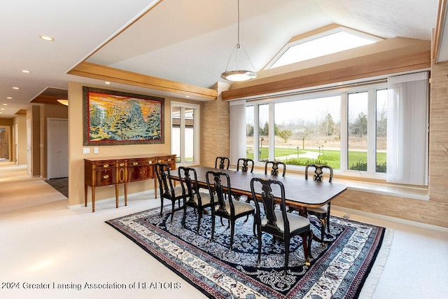 dining room with lofted ceiling