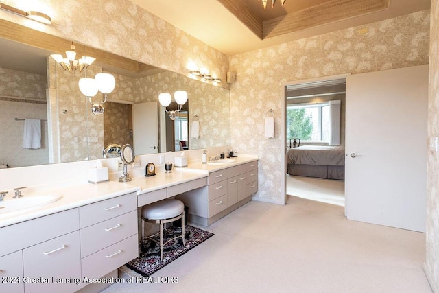 bathroom featuring vanity and a chandelier