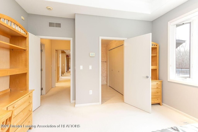 unfurnished bedroom featuring light colored carpet