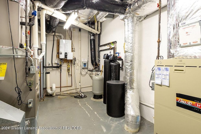 utility room with tankless water heater