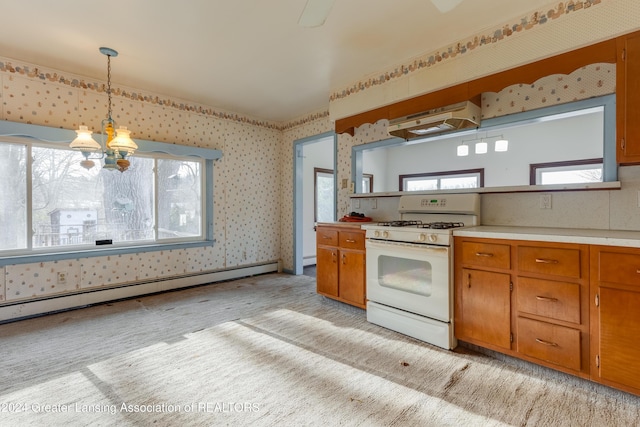 kitchen with white gas range, baseboard heating, decorative light fixtures, light carpet, and exhaust hood