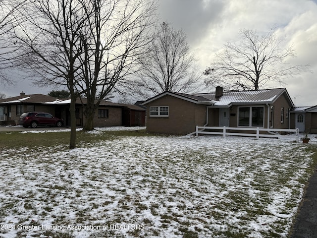 view of snow covered house