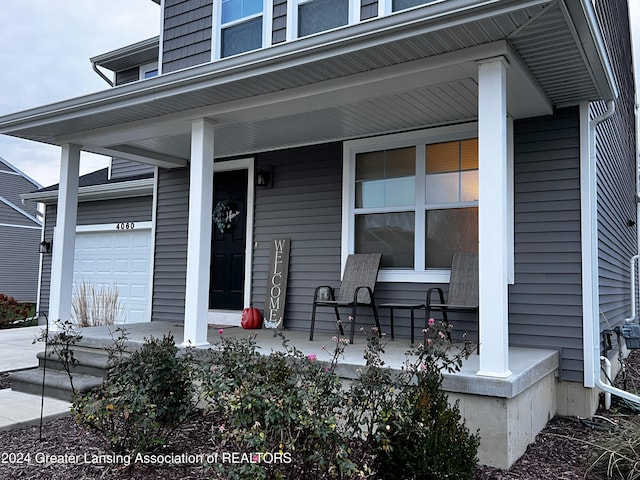 property entrance with covered porch