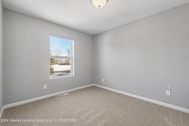 empty room featuring carpet flooring