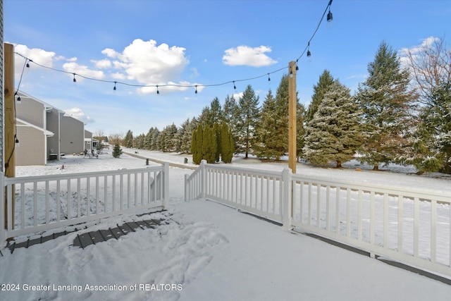 view of yard layered in snow