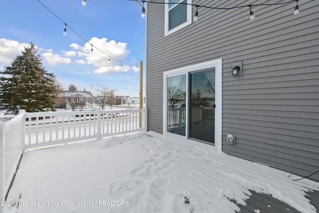 view of snow covered deck