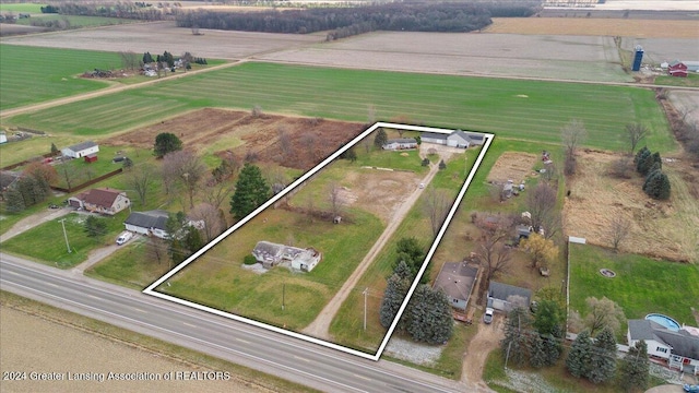 birds eye view of property featuring a rural view