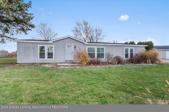 ranch-style home with a front yard