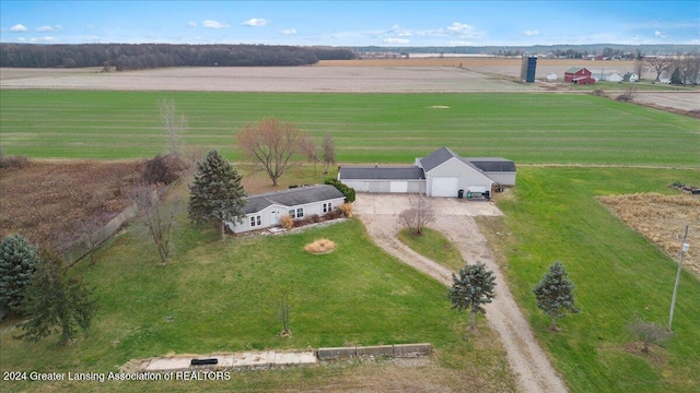 birds eye view of property with a rural view