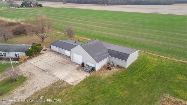 birds eye view of property with a rural view