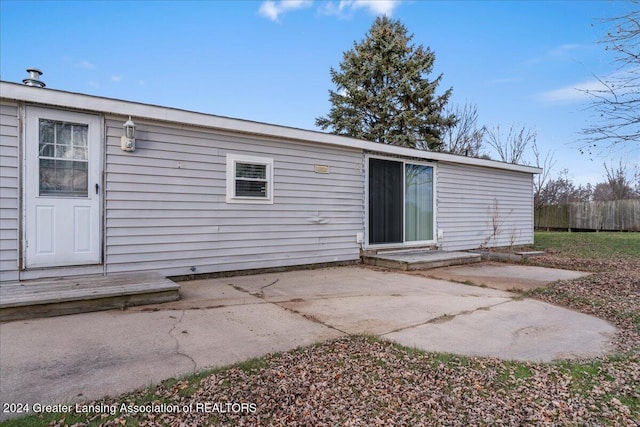 back of property featuring a patio area