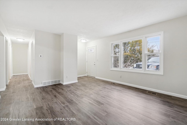 unfurnished room featuring wood-type flooring