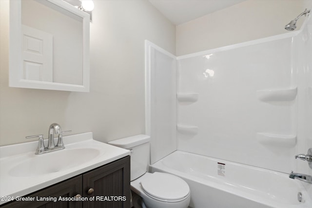 full bathroom with vanity, toilet, and shower / washtub combination