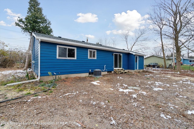 back of property with central air condition unit