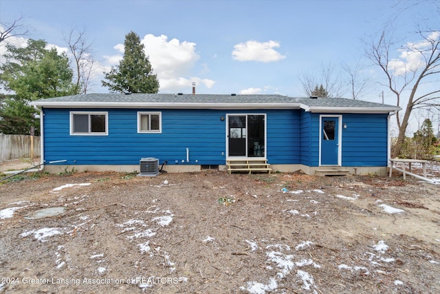 rear view of property with central air condition unit