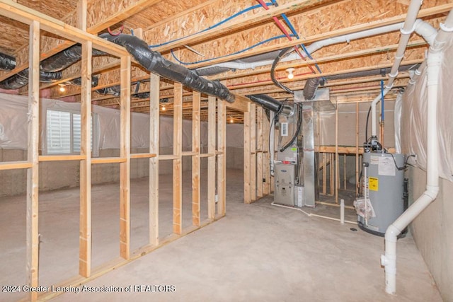 basement featuring heating unit and water heater