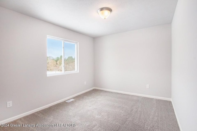 unfurnished room with carpet floors