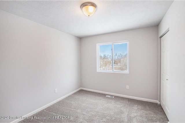 empty room with carpet floors