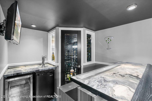 bar with dishwasher, wine cooler, and sink