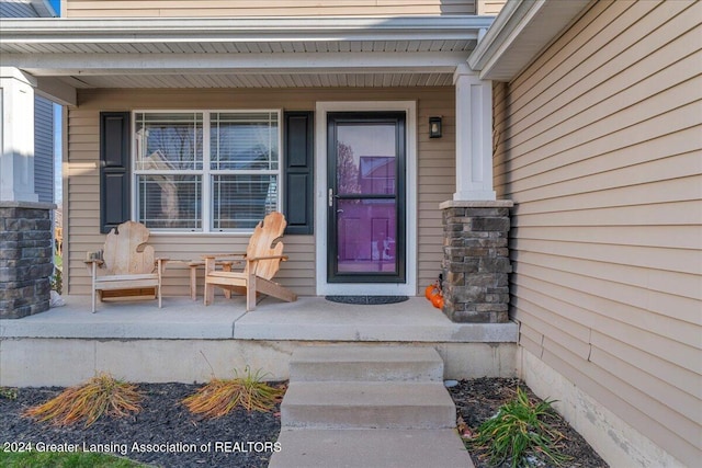 doorway to property with covered porch