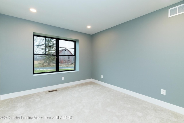 empty room with light colored carpet