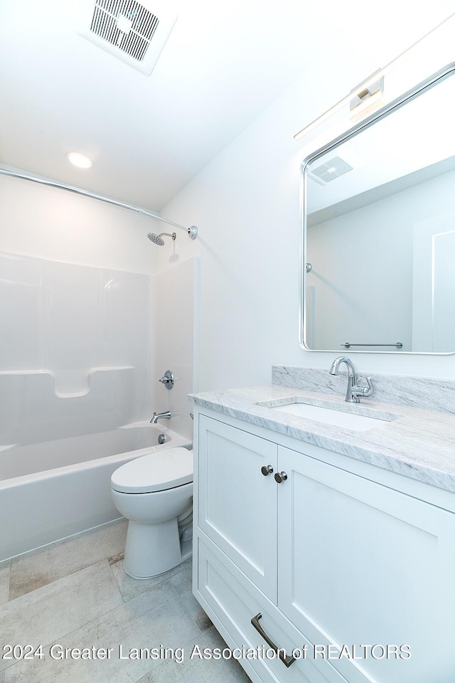 full bathroom featuring tile patterned floors, vanity,  shower combination, and toilet