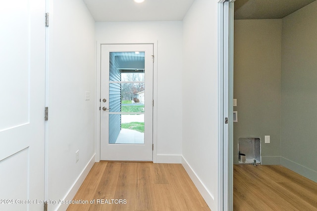 doorway with light hardwood / wood-style floors