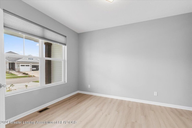 unfurnished room featuring light hardwood / wood-style flooring