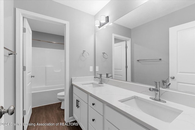 full bathroom featuring shower / bath combination, vanity, toilet, and wood-type flooring