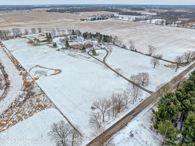 snowy aerial view with a rural view