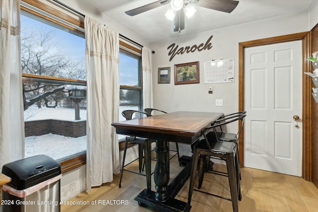 dining area featuring ceiling fan and light wood-type flooring