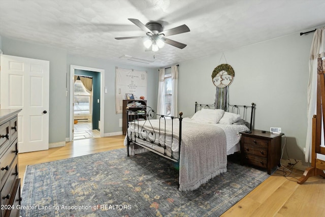 bedroom featuring light hardwood / wood-style floors and ceiling fan