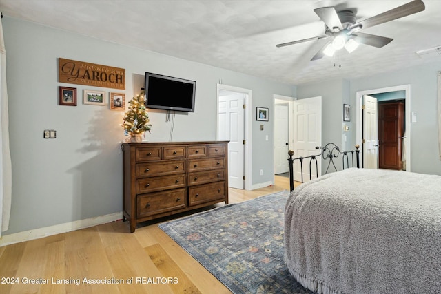 bedroom featuring ceiling fan and light wood-type flooring