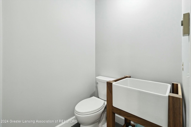 bathroom with toilet and sink