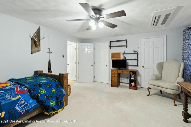 bedroom featuring ceiling fan and light carpet