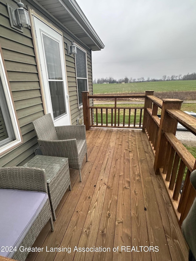 wooden terrace with a rural view