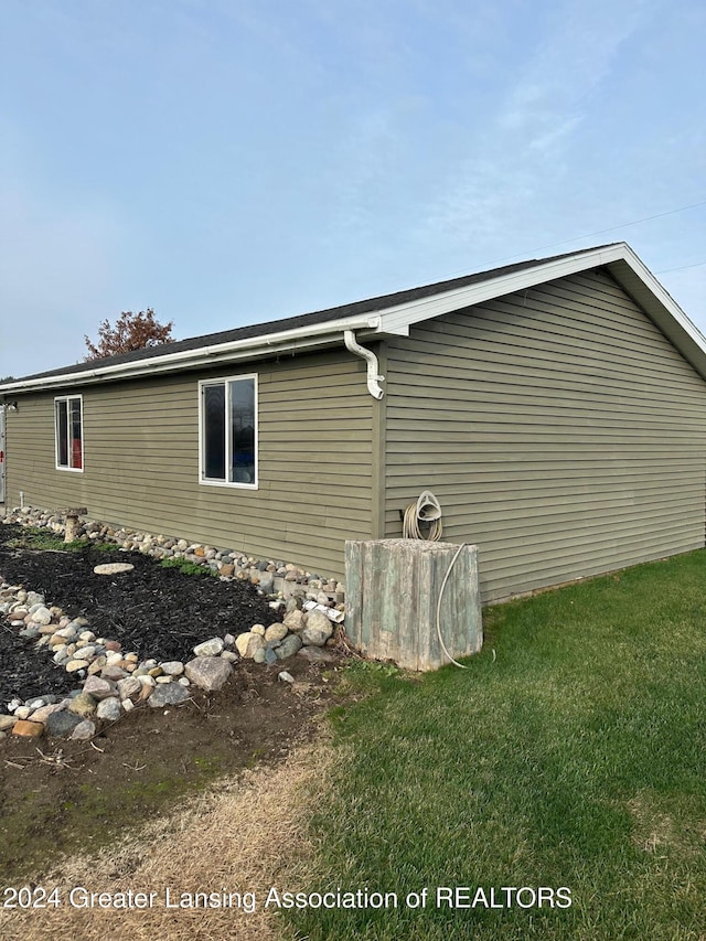 view of property exterior featuring a yard