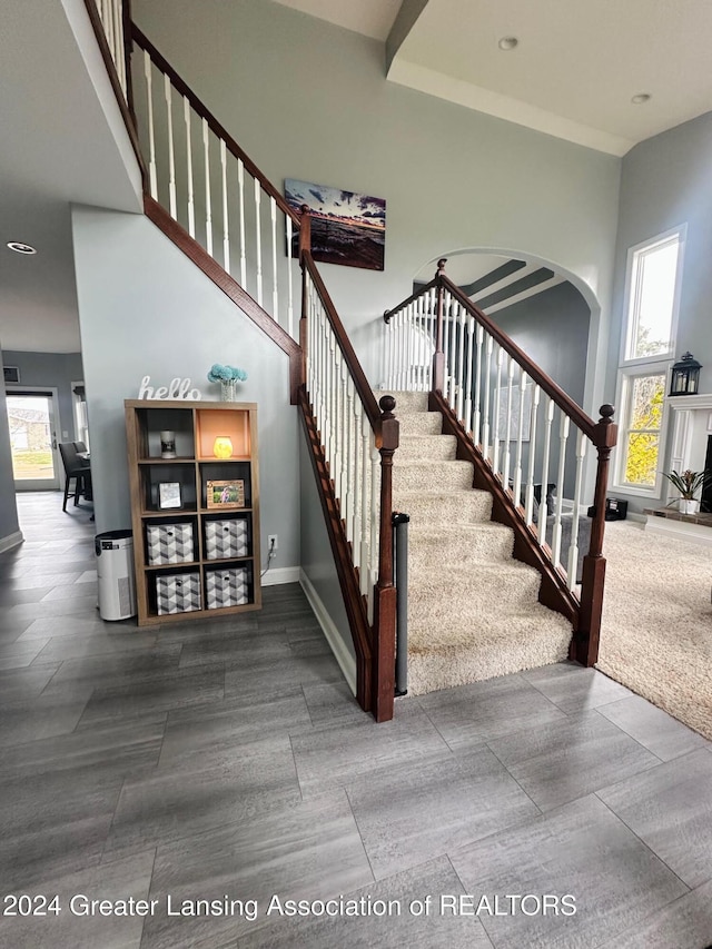 stairway featuring plenty of natural light