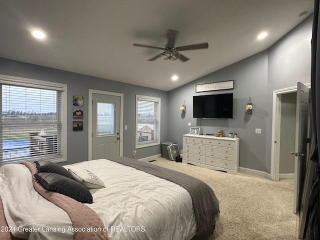 bedroom featuring carpet flooring, ceiling fan, lofted ceiling, and multiple windows