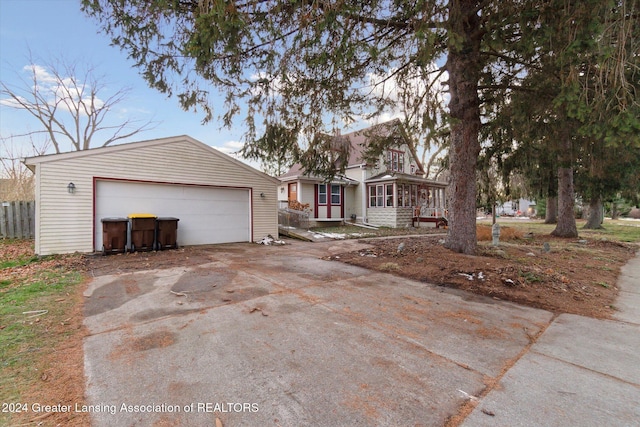 view of front of property featuring an outbuilding and a garage