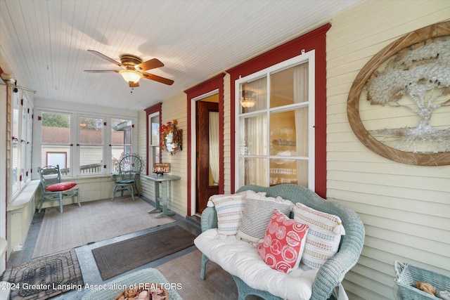 sunroom / solarium with ceiling fan