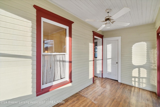 interior space featuring ceiling fan and wood ceiling