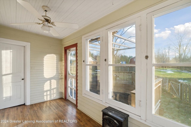 unfurnished sunroom with ceiling fan and wooden ceiling