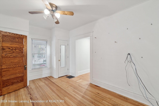 spare room with ceiling fan and light hardwood / wood-style flooring