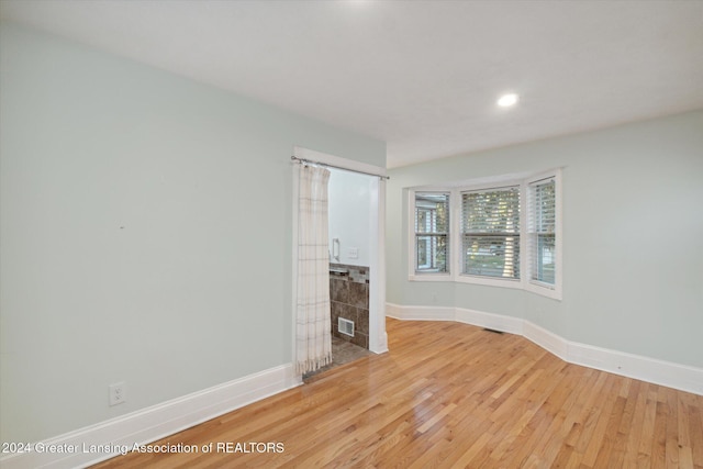 unfurnished living room with light hardwood / wood-style floors