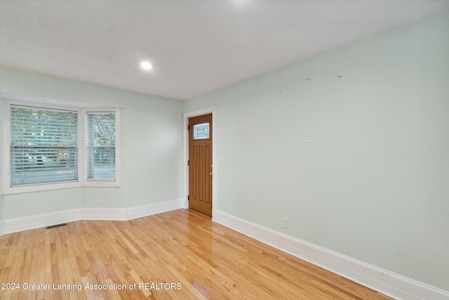 unfurnished room featuring light hardwood / wood-style floors