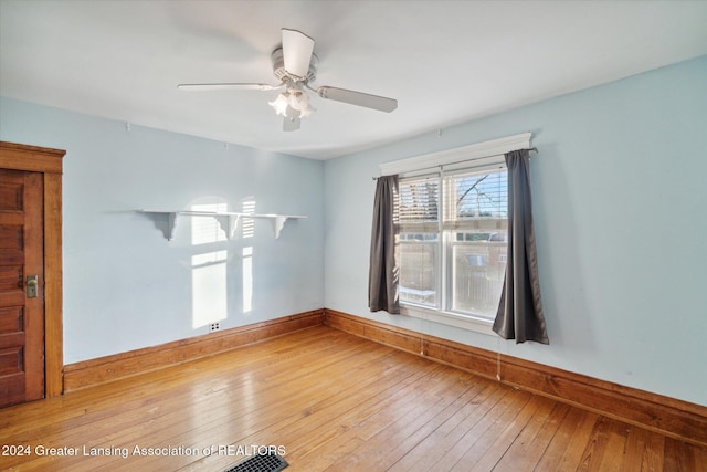 empty room featuring ceiling fan and wood-type flooring