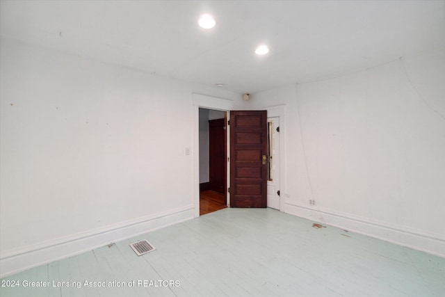 empty room with hardwood / wood-style floors