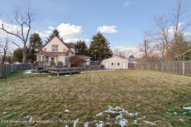 view of yard with an outbuilding and a deck